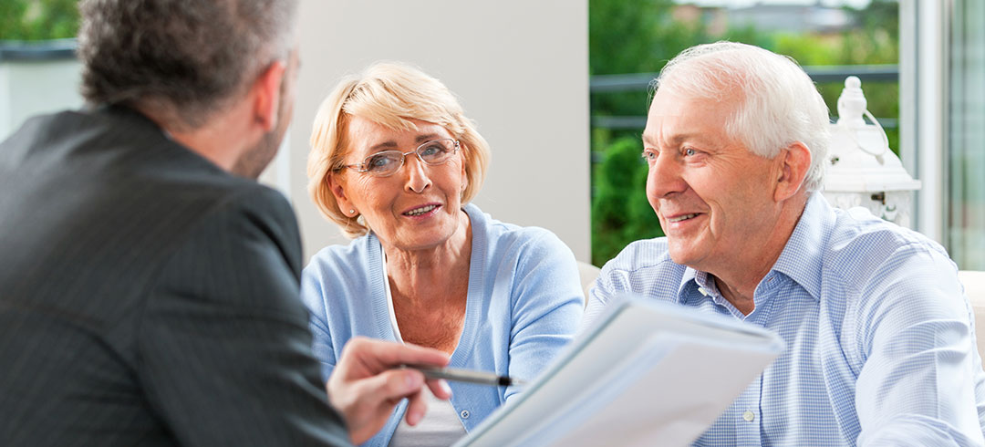 Agent explaining medicare insurance plans Agent explaining medicare insurance plans