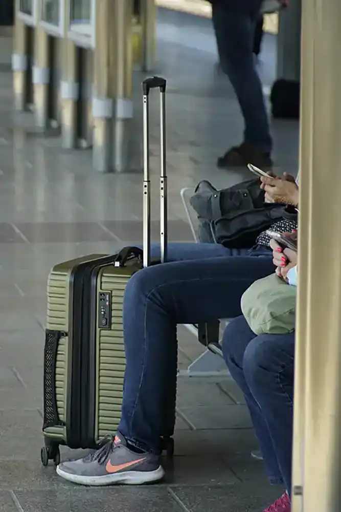 Person sitting with luggage